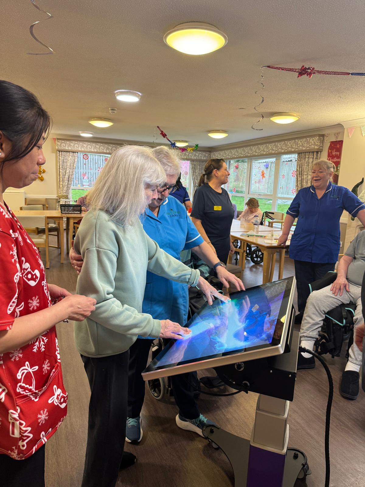 Residents engaging with T3CH table