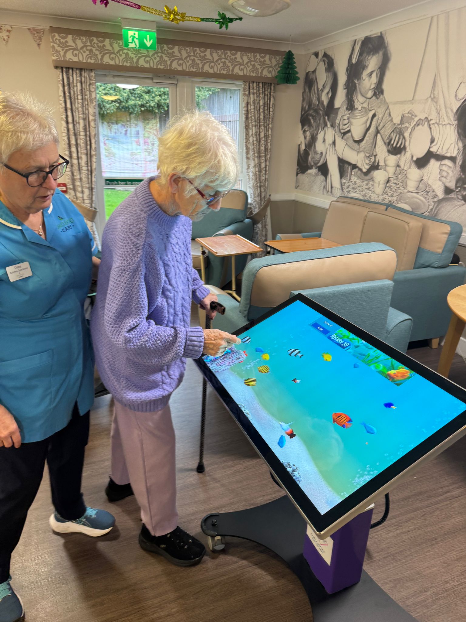 Staff member with resident using T3CH table